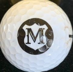 M in emblem inside circle